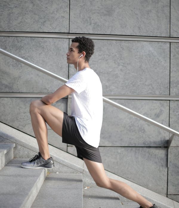 Active person doing gentle dynamic exercises in a modern space